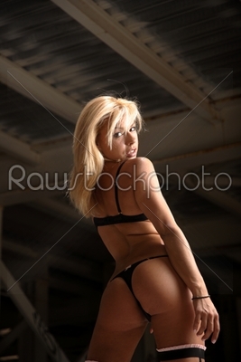 A lovely blonde woman wearing sexy lingerie