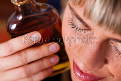 Alcohol abuse - woman drinking too much brandy