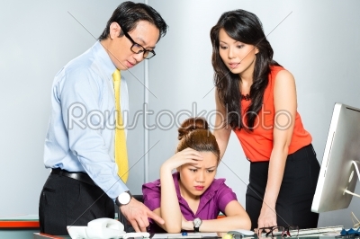 Asian colleagues mobbing or bullying employee 