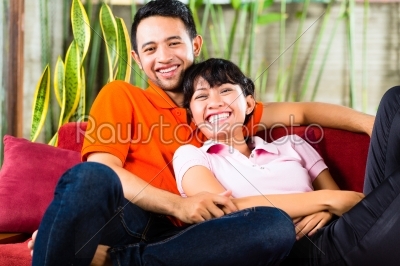 Asian couple at home