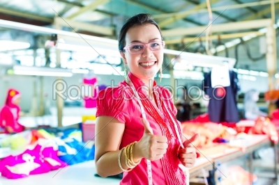 Asian dressmaker in a textile factory