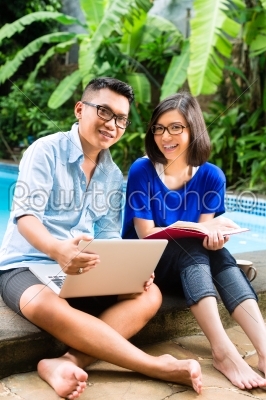 Asian prosperous couple in the garden