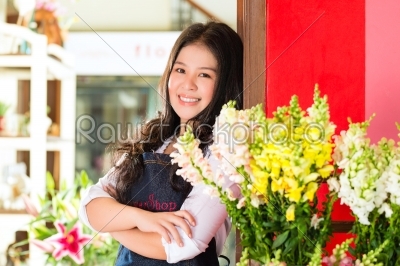 Asian Saleswoman in a flower shop
