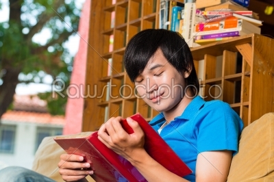 Asian student reading book or textbook learning