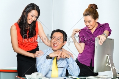 Asian Womanizer boss flirting at the office