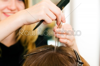 At the hairdresser - woman gets new hair colour
