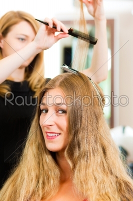 At the hairdresser - woman gets new hair colour