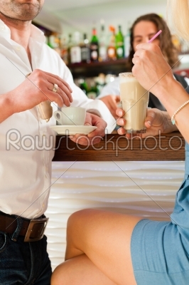 Attractive couple in cafe or coffeeshop