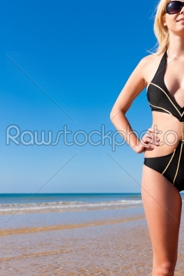 Attractive Woman in monokini on beach