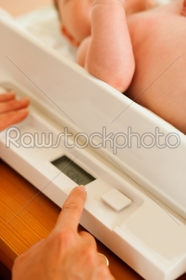 Baby on weight scale