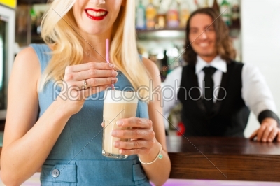 Barista with client in his cafe or coffeeshop