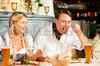 Bavarian Couple in restaurant eating