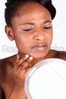 Beautiful African woman in Studio with mirror