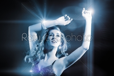 Beautiful girl dancing in club disco