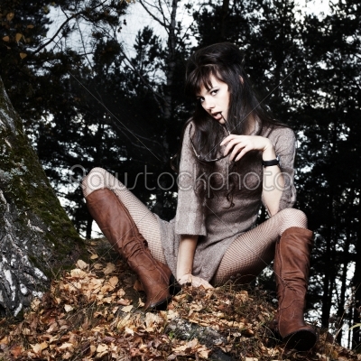 Beautiful girl in autumn wood