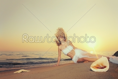 Beautiful young woman on the beach