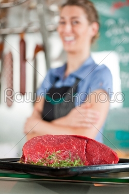 Beef Meat with Butcher in Background