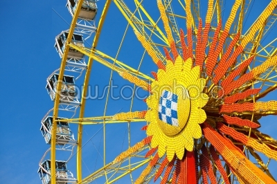 Big wheel in front of blue sky 