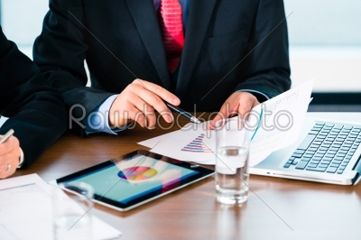 Business - Businesspeople working with tablet Computer