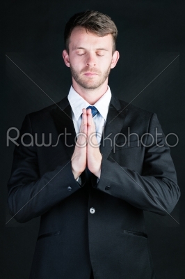 Business man praying 