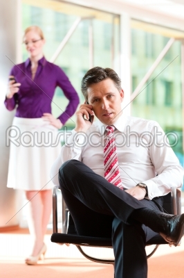 Business people - boss and secretary in office
