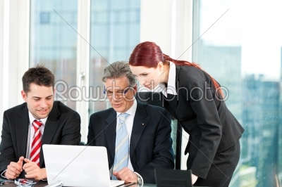 Business people - team meeting in an office