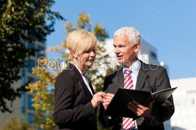 Business people talking outdoors