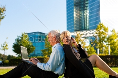 Business people working outdoors