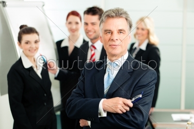 Business Team with leader in office