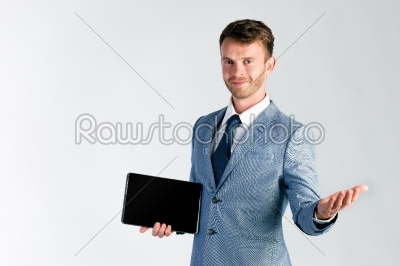 Businessman presenting tablet computer