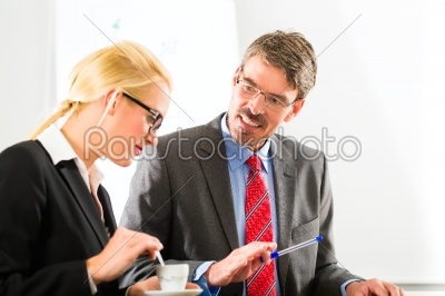businesspeople in business office drink coffee