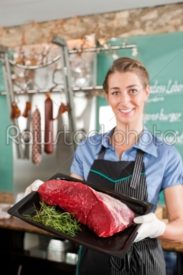 Butcher Holding Beef Served on Tray