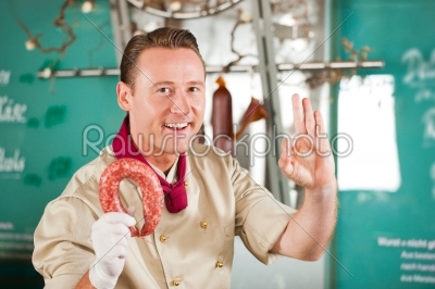 Butcher working in a butchers shop