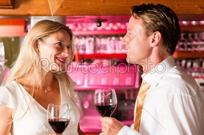 Casual Businesspeople flirting in hotel bar