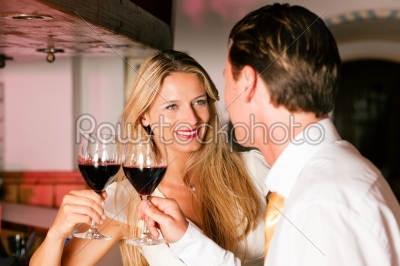 Casual Businesspeople flirting in hotel bar