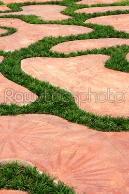 Cement walkways decorated with grass.