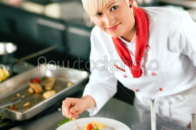 chef in restaurant kitchen cooking