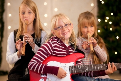 Children making music for Christmas