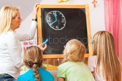 Children playing school at home