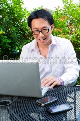 Chinese Businessman working outdoor