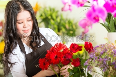 Chinese Saleswoman in a flower shop
