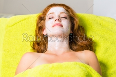 Cosmetics and Beauty - woman with facial mask