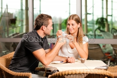 Couple drinking coffee in cafe