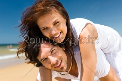Couple enjoying freedom on the beach