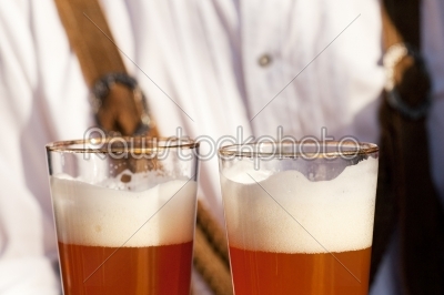 Couple in Bavarian Tracht clinking glasses 