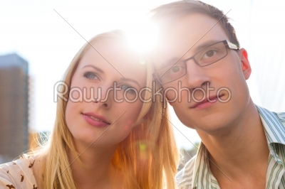 Couple in love looking dreamily into the sky