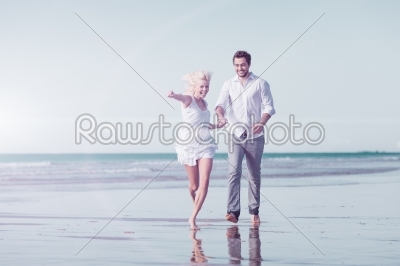 Couple on beach in honeymoon vacation