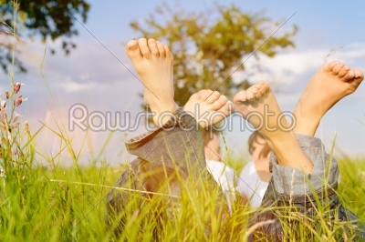 Couple on meadow in summer vacation
