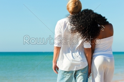 Couple on sunny beach in summer