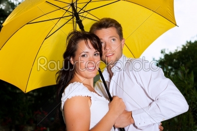 Couple with a yellow umbrella